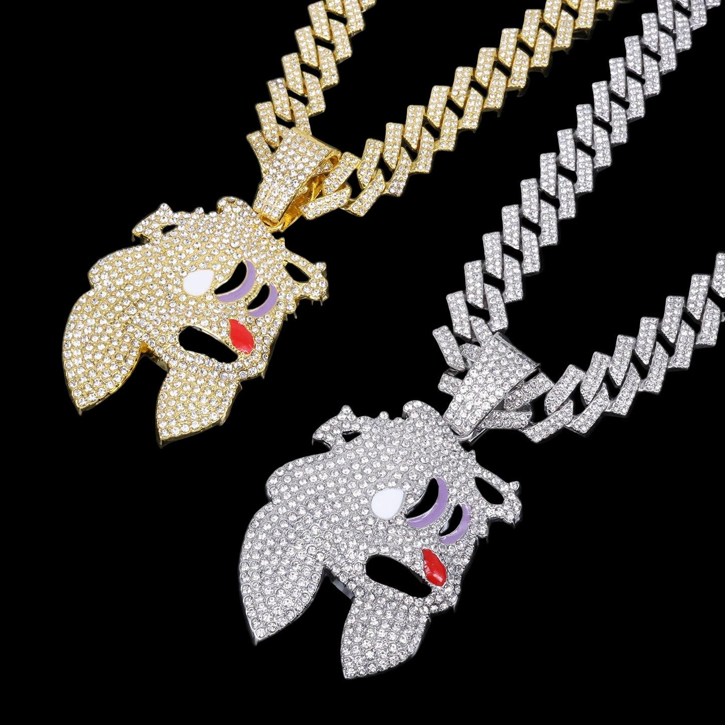 Two diamond-encrusted ghost pendants on gold and silver chains against a black background.