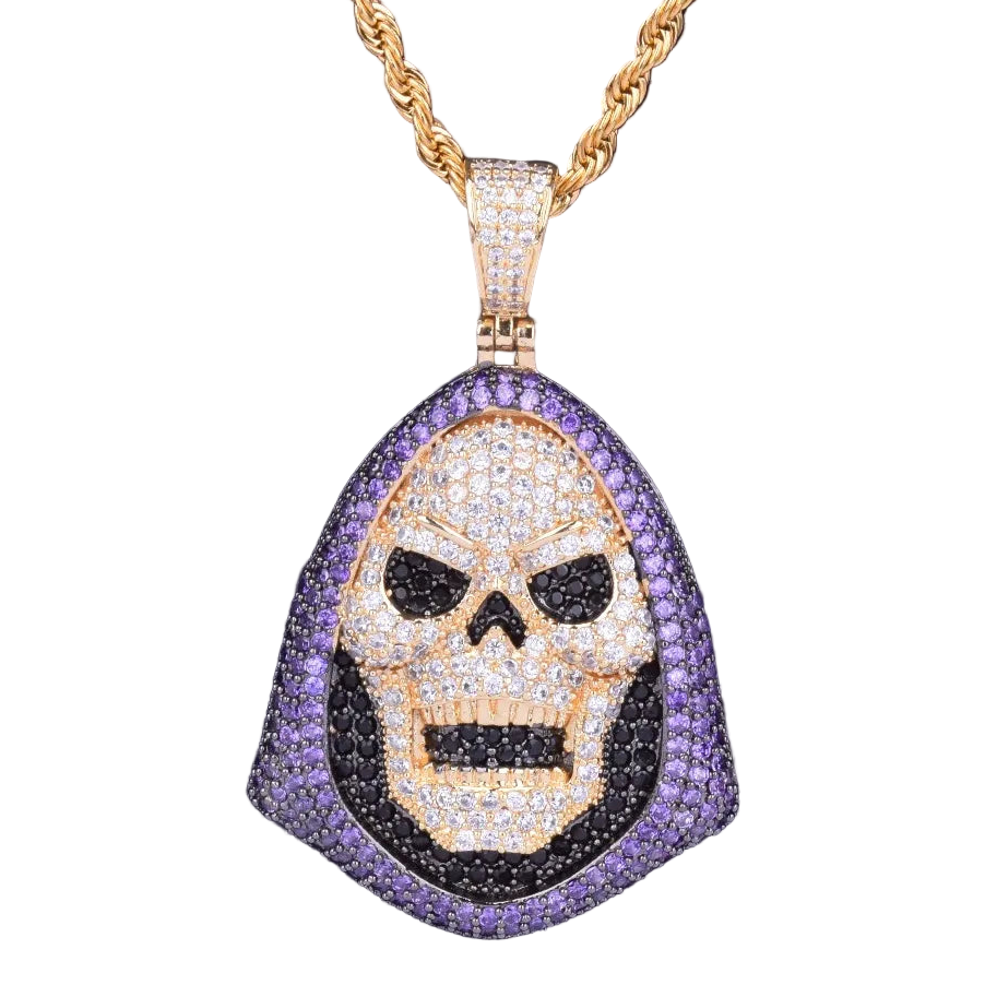 Skull pendant necklace with gold chain on a dark background