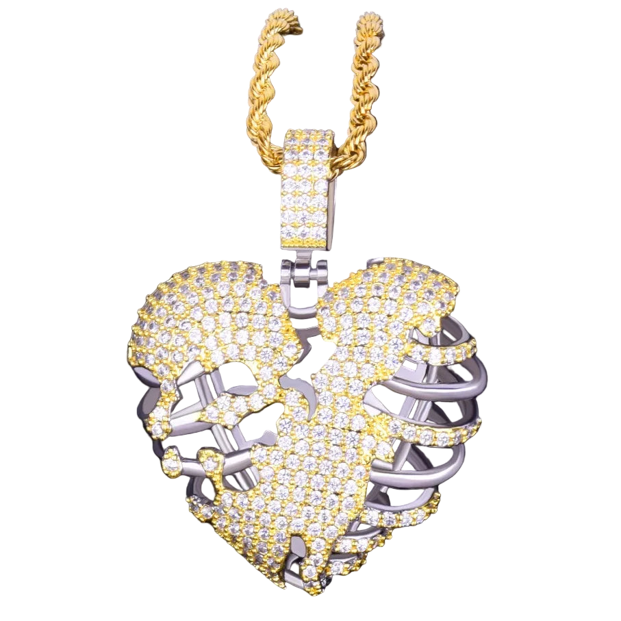Gold and silver ram head pendant on a black background