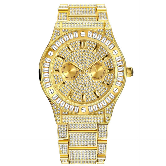 A fully iced-out luxury watch with a gold band and dial, featuring a detailed pattern of emerald gems.