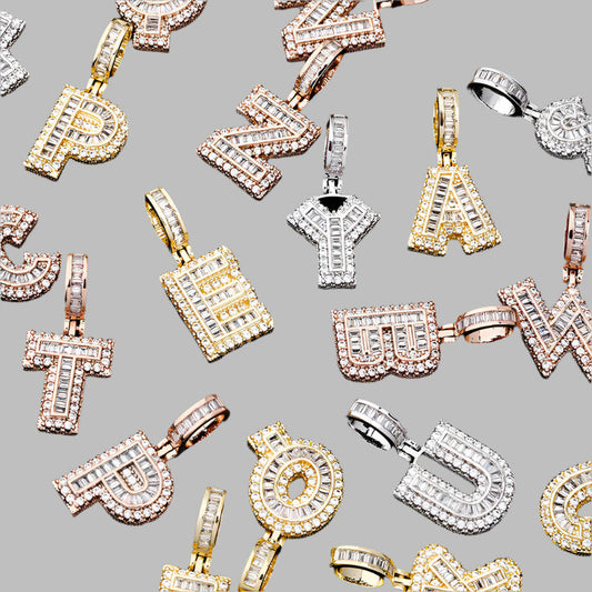 DatNewDrip iced out alphabet pendant collection in gold and silver with baguette and round stones