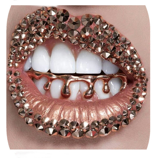 DatNewDrip gold hip hop grillz close up on model mouth with rose gold rhinestone lips and dripping lower grill