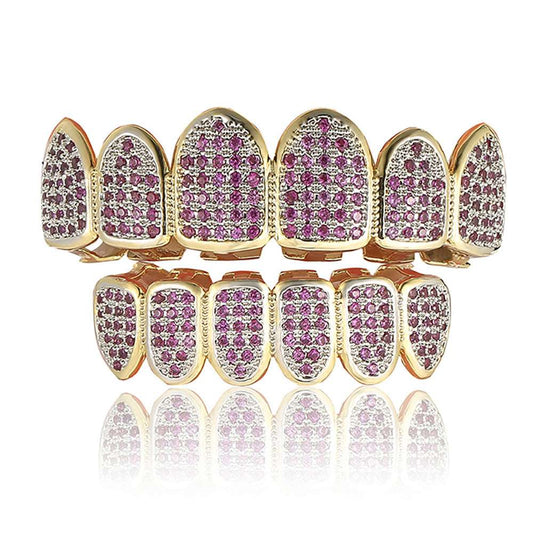Gold upper and lower full set purple gem grillz with pave purple stones on reflective white background