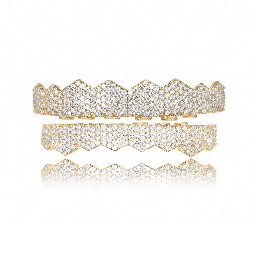 Gold two piece iced out flat tooth grillz set with zigzag flat teeth and pave crystals on display