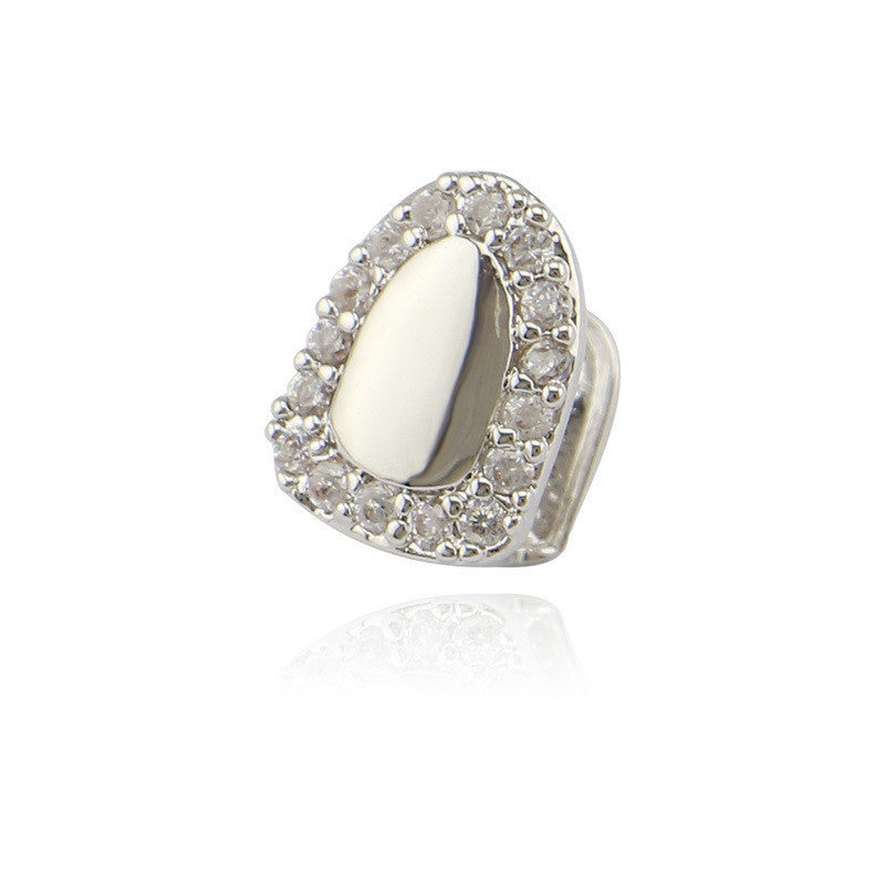 iced out single tooth grillz teardrop silver tooth cap with surrounding clear stones and polished center