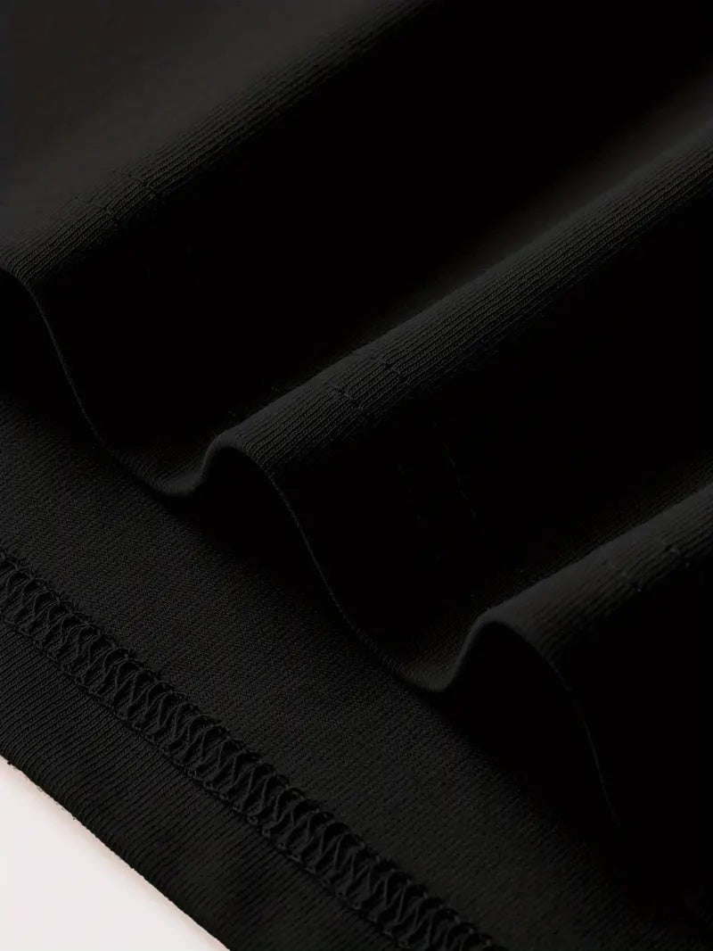 Close-up of the fabric texture of a black Graphic Streetwear T-Shirt showing its soft, smooth finish