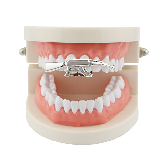 DatNewDrip silver AK47 grillz for teeth displayed on dental model showcasing upper front tooth accessory