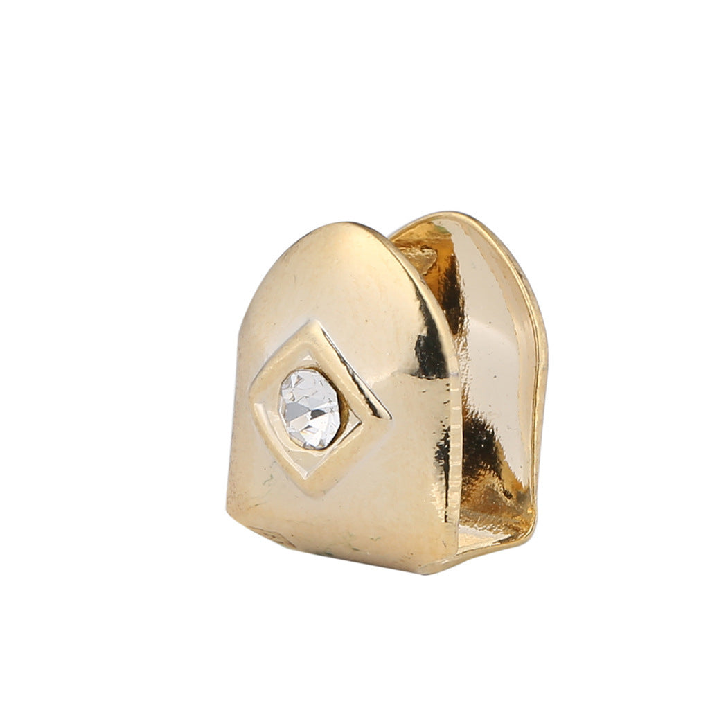 Gold single diamond tooth grillz cap with embedded clear diamond accent for one upper tooth