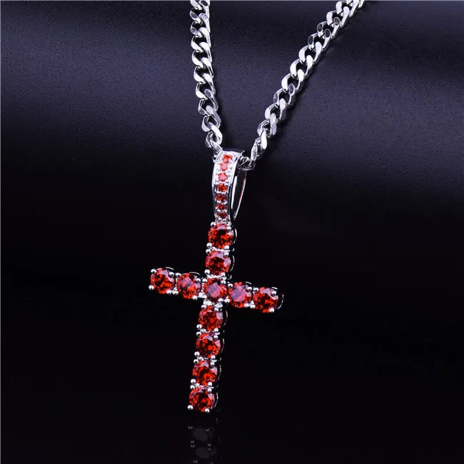 Shiny hip hop cross necklace with red gemstones on a silver chain for a stylish look