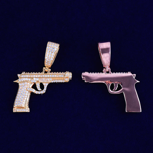 Two iced out gun necklaces in gold and rose gold with sparkling rhinestones for bold fashion statements