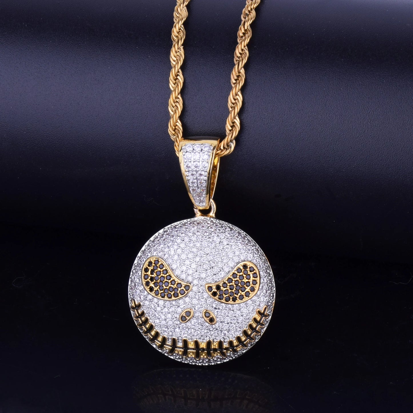 Iced out Jack Skeleton smiling pendant necklace with sparkling details and a gold chain