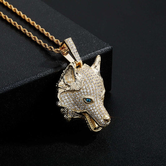 DatNewDrip iced out wolf pendant in gold with detailed blue eyes and sparkling stones on a twisted chain