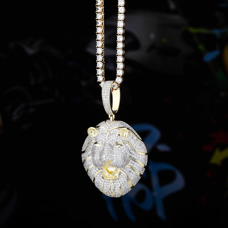 DatNewDrip iced out lion head pendant in gold and silver with pave diamonds on a tennis chain