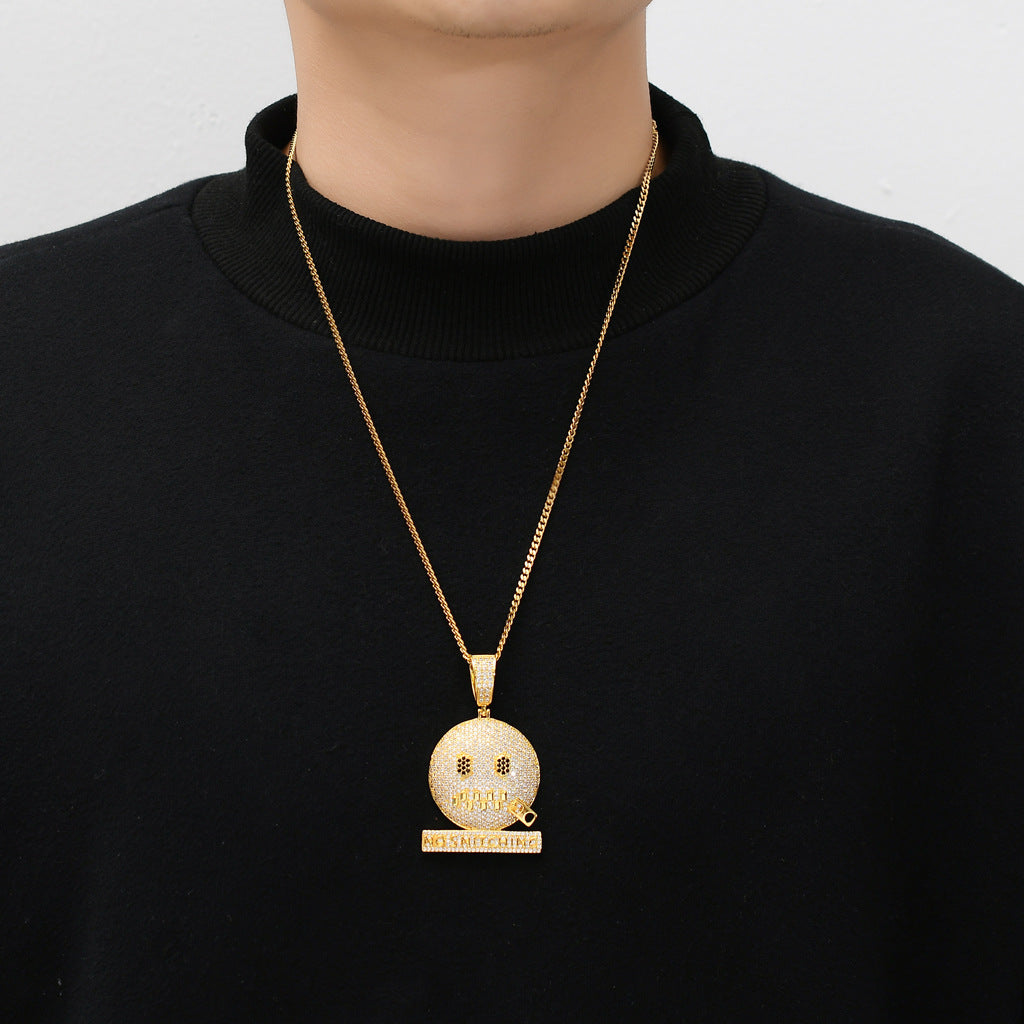 DatNewDrip iced out no rats pendant gold emoji face pendant on gold chain modeled on black sweater