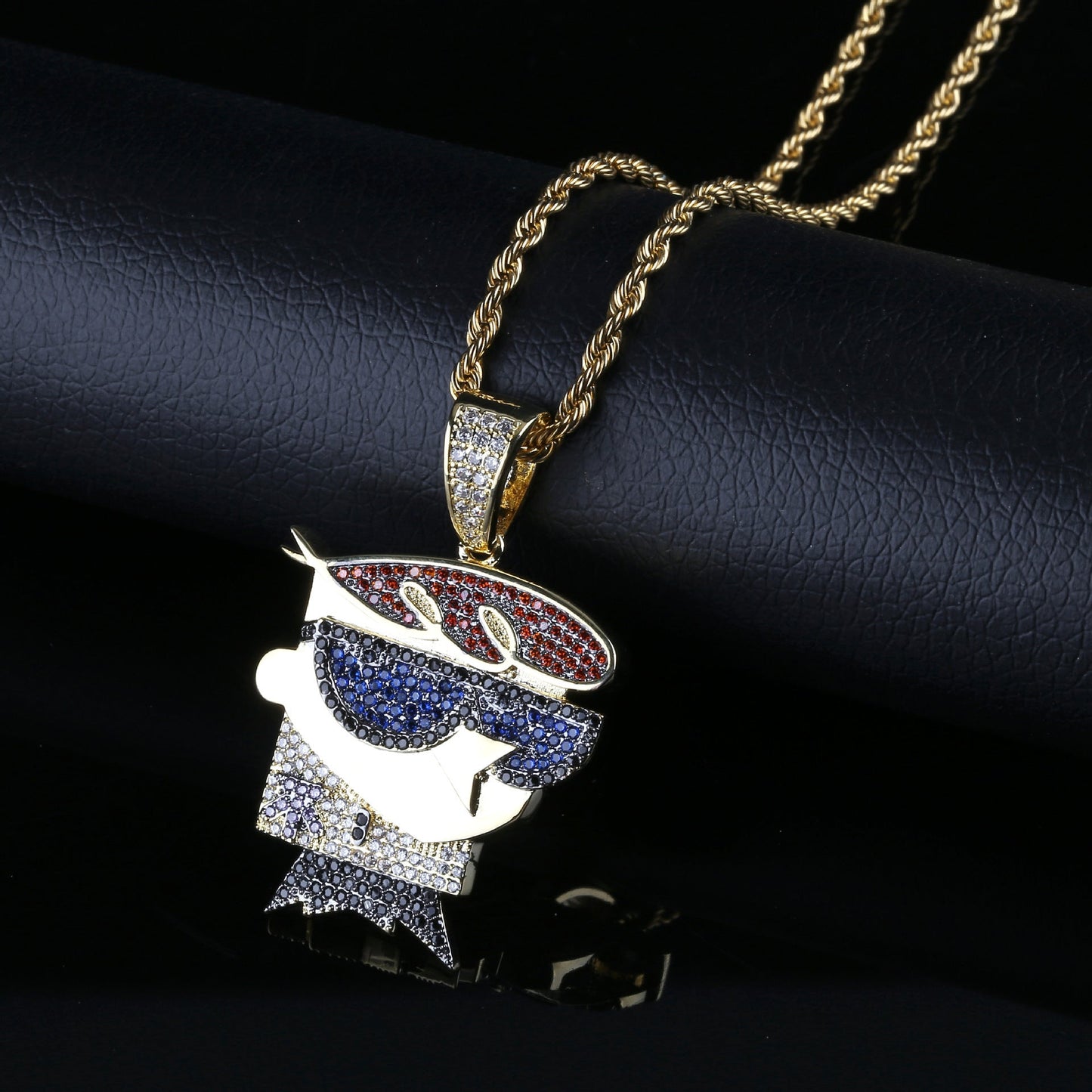 DatNewDrip gold Dexters Laboratory iced out pendant with red blue and clear cubic zirconia stones on rope chain
