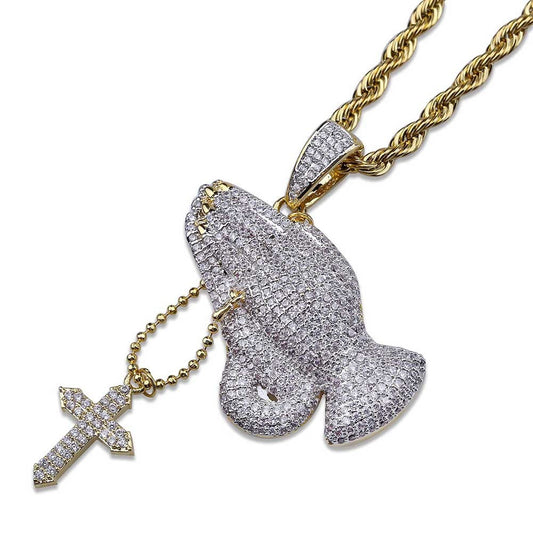 DatNewDrip iced out praying hands pendant on gold rope chain with cross charm pave stones
