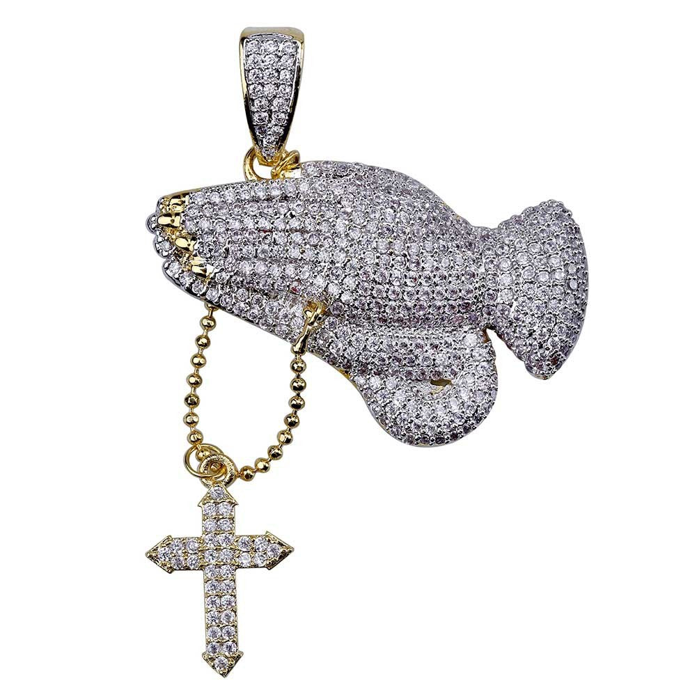 DatNewDrip iced out praying hands pendant in gold and silver with pave stones and dangling cross