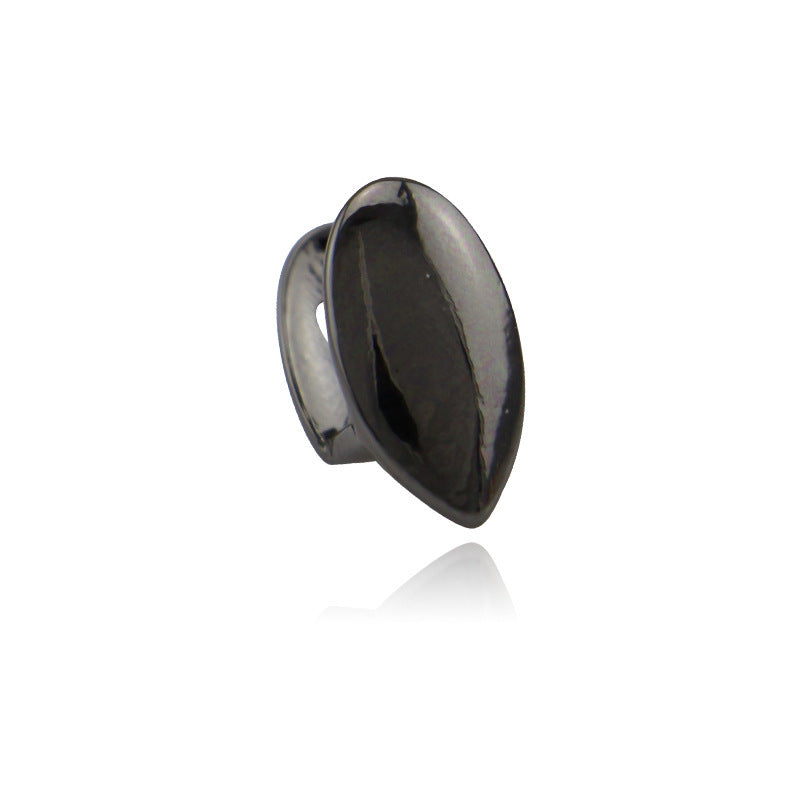 DatNewDrip black single tooth fang grillz for teeth shiny metal vampire style cap on white background