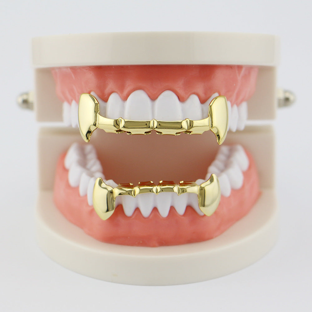 DatNewDrip gold fang grillz for teeth displayed on upper and lower dental model for costume wear