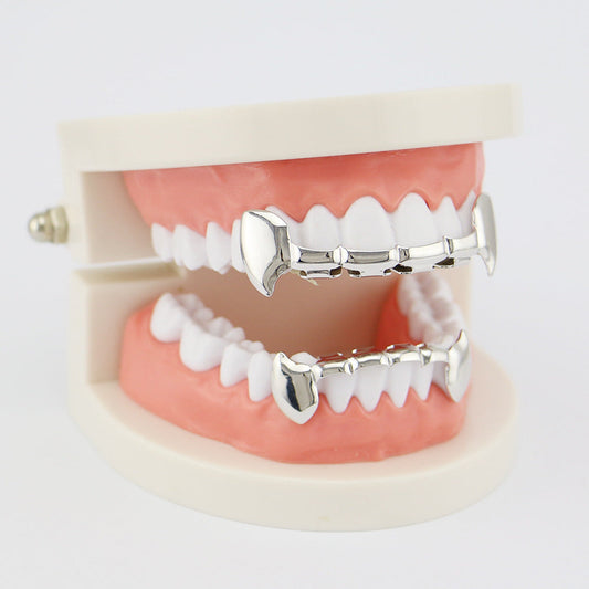 DatNewDrip silver fang grillz for teeth on upper and lower dental model showing front fangs