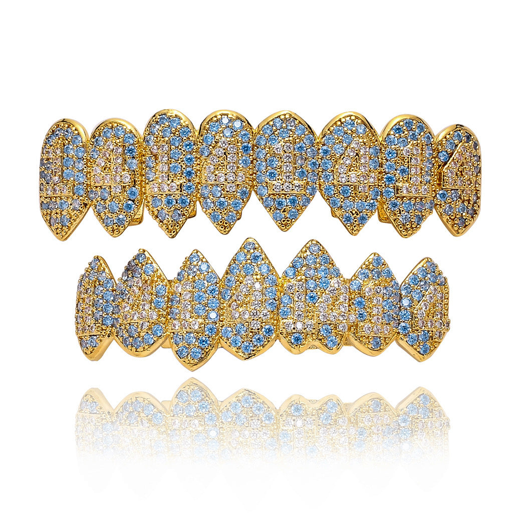 DatNewDrip gold plated iced out monster fang grillz set with blue and clear stones top and bottom