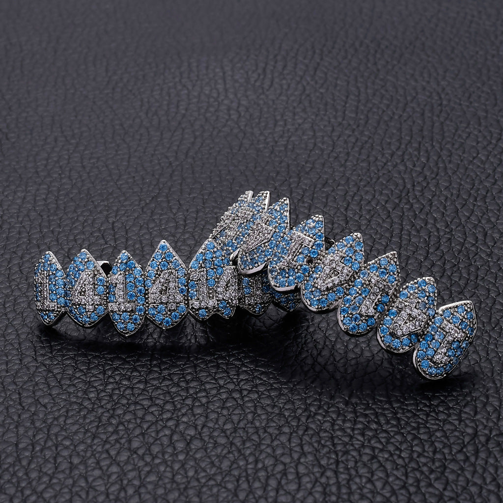 DatNewDrip iced out monster fang grillz in silver with blue and clear stones detailed fang design