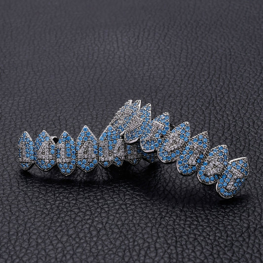 DatNewDrip iced out monster fang grillz in silver with blue and clear stones detailed fang design
