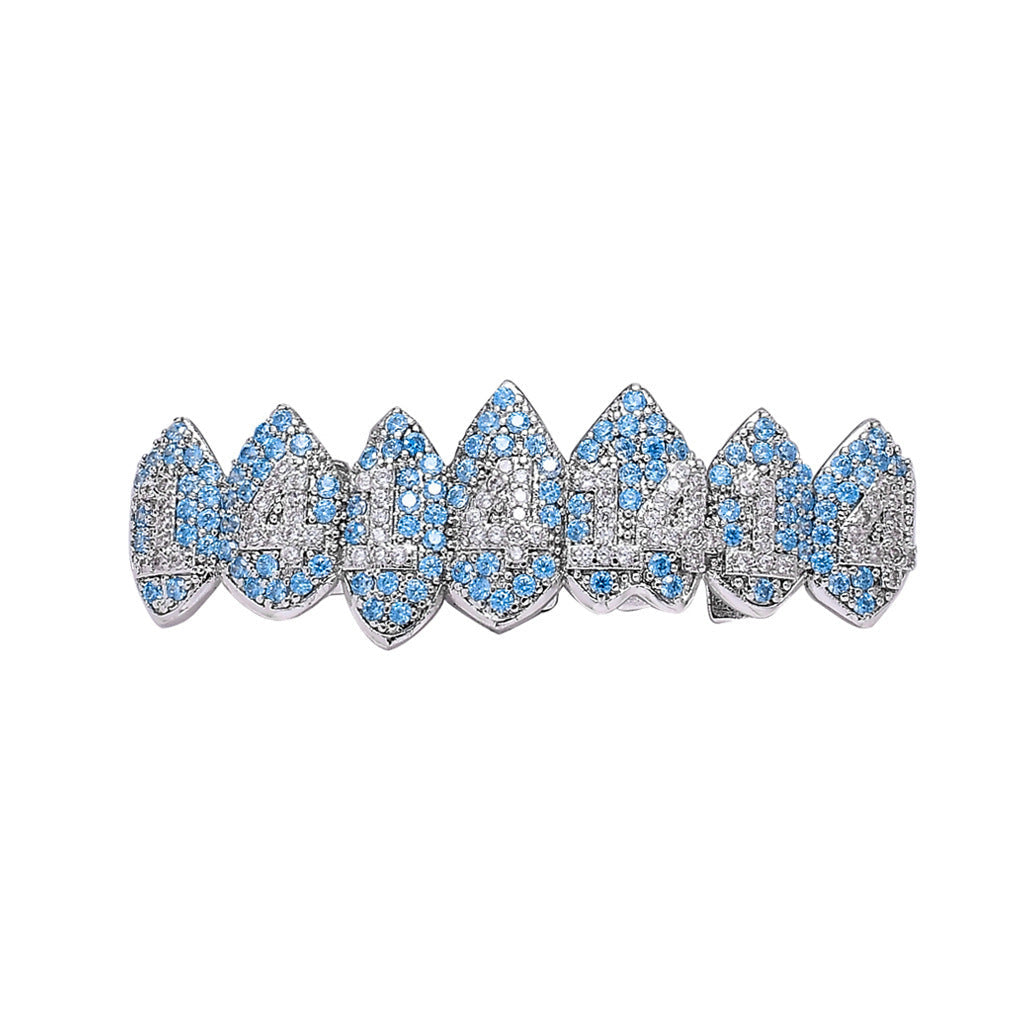 DatNewDrip iced out monster fang grillz silver tone with blue and clear stones for dramatic fang tooth look