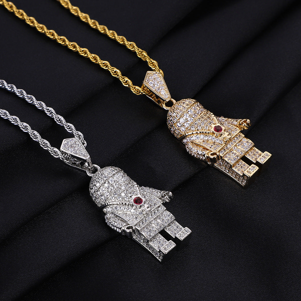 DatNewDrip iced out spaceman pendant pair gold and silver diamond encrusted astronaut charms with red center stone on rope chains