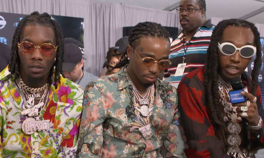 Three men in patterned shirts wearing layered chains featuring Iced Out Crash Bandicoot pendant by DatNewDrip