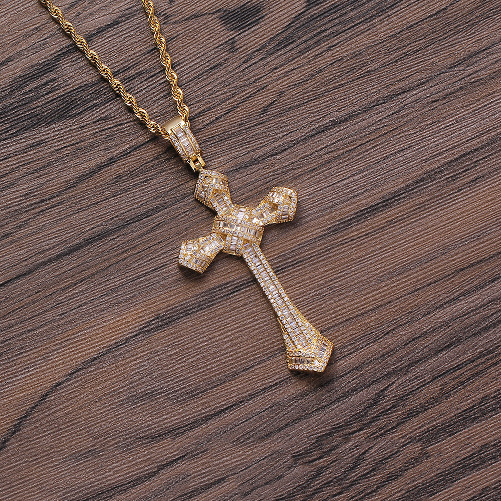 DatNewDrip iced out cross pendant gold micro pave stones on rope chain on wood background