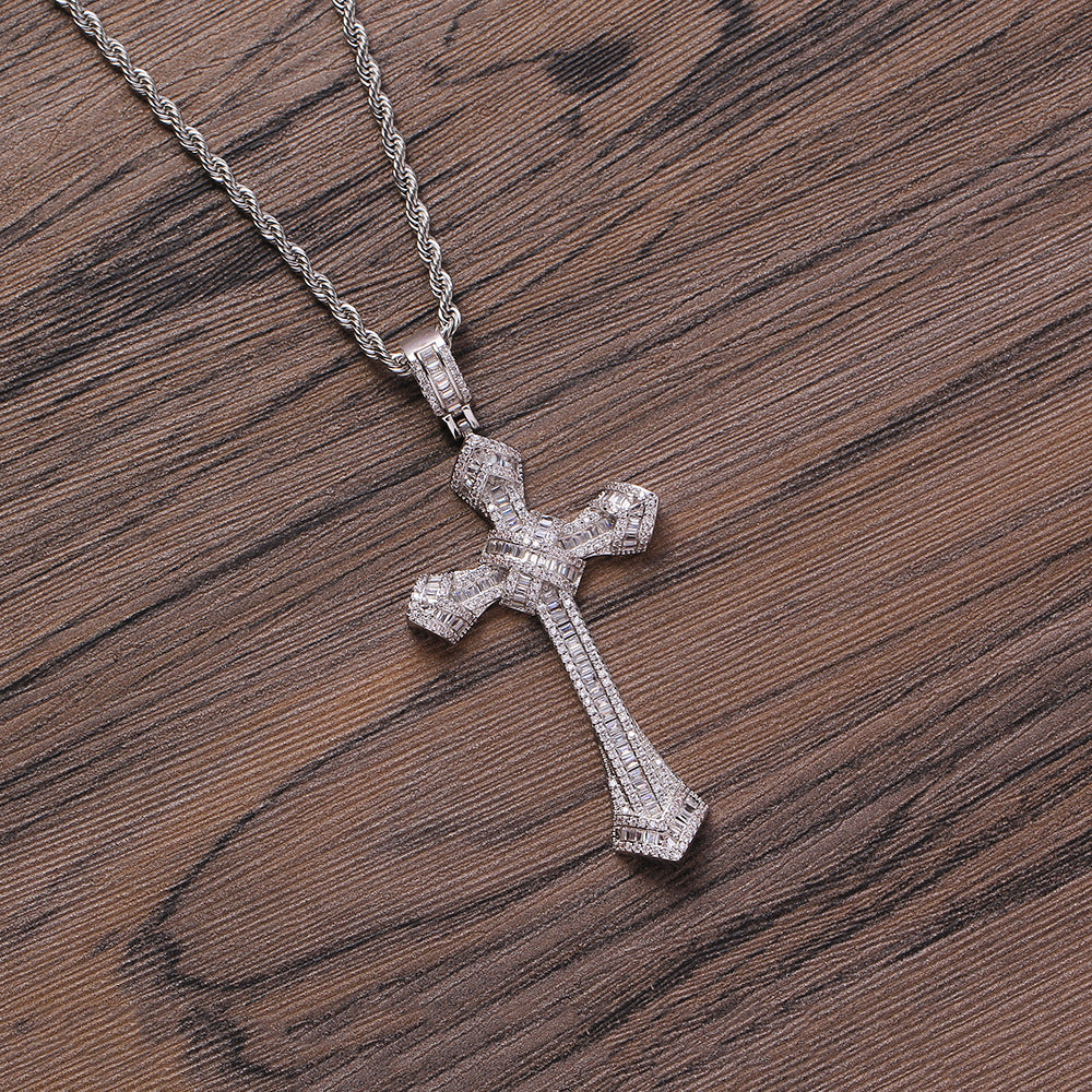 DatNewDrip iced out cross pendant on silver rope chain sparkling cubic zirconia cross on wooden background