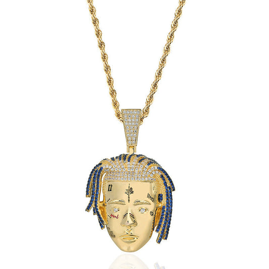 DatNewDrip gold chain necklace with detailed XXXTentacion face pendant featuring blue and clear stones