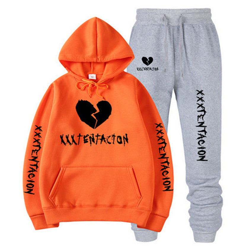 Orange hoodie and gray sweatpants set featuring XXXTENTACION hip-hop hoodie and sweatpants design with broken heart graphics