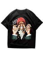 Black t-shirt with a graphic of a person wearing a red cap and chains on a white background