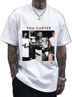 White t-shirt with a graphic design featuring a collage of images and text, worn by a person.