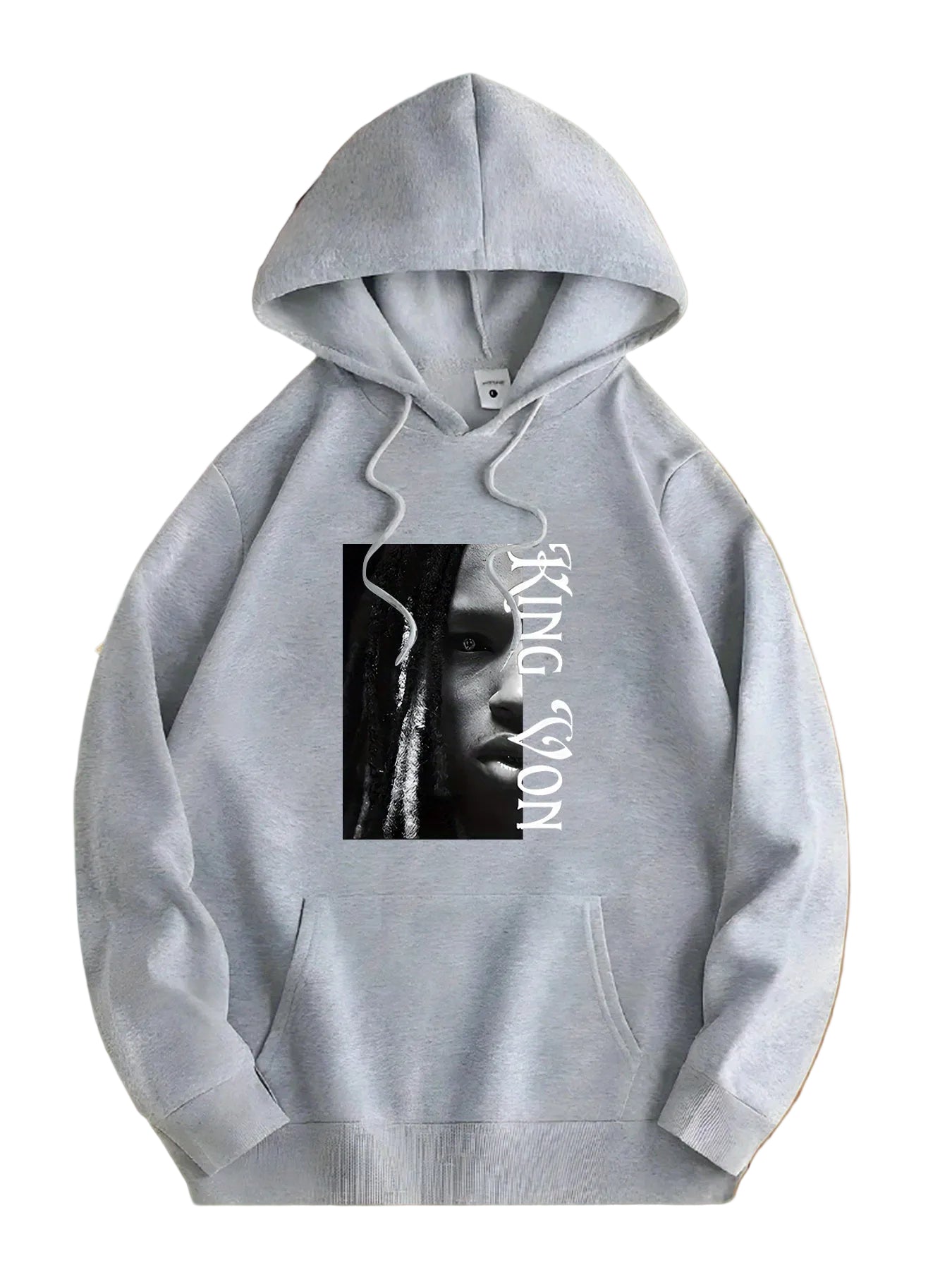 Gray hoodie with a graphic design on a wooden surface with flowers.
