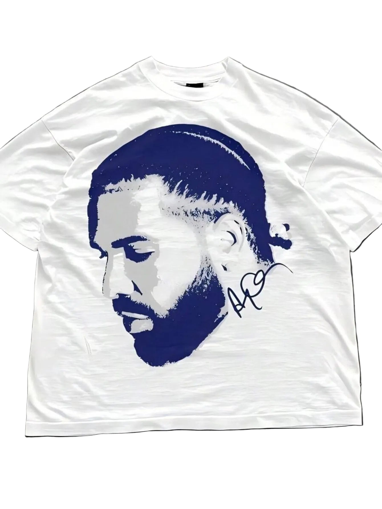 White t-shirt with blue graphic of a face on a gray surface