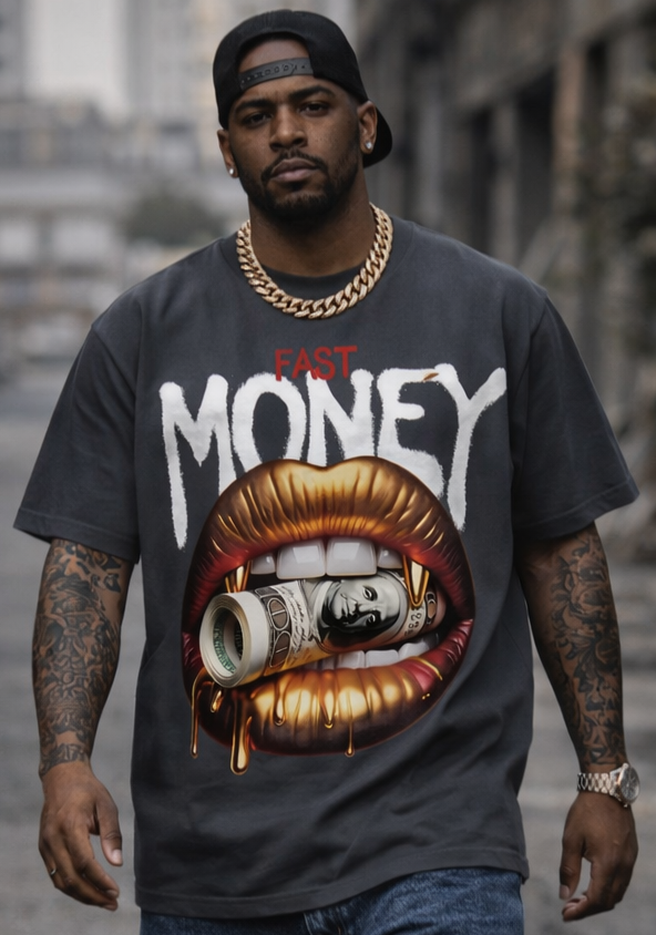 Man wearing a graphic t-shirt with a mouth and money design on an urban street.