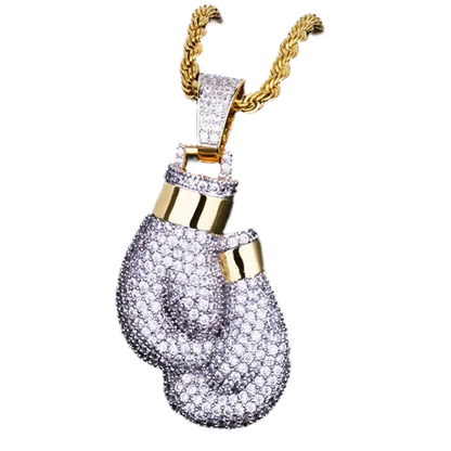 Gold and silver boxing glove pendant on a dark background
