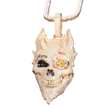 Gold pendant with intricate designs on a blue background