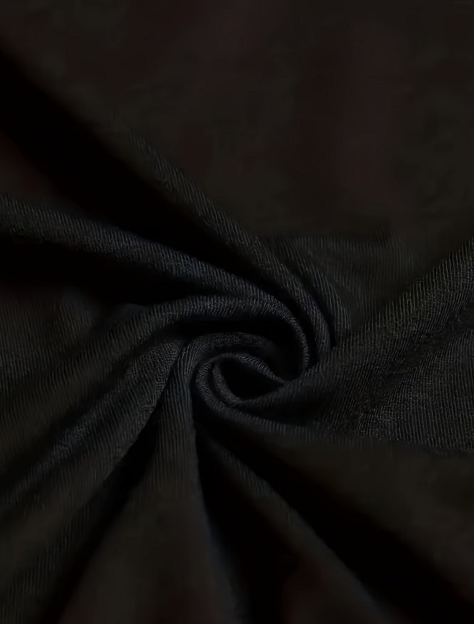 Close-up of soft black fabric showing texture of Alien Workshop t-shirt