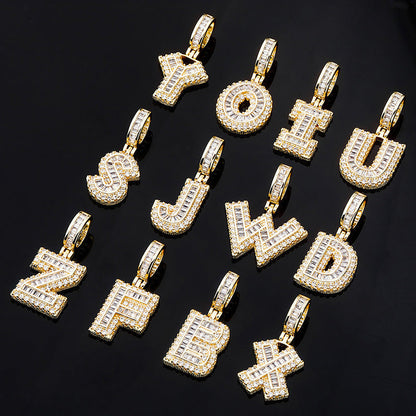 DatNewDrip iced out alphabet pendant collection gold letter charms encrusted with cubic zirconia on black