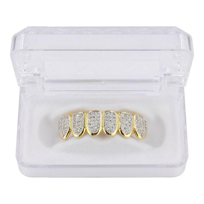 DatNewDrip gold six tooth iced out grillz with pave diamonds displayed in clear plastic case