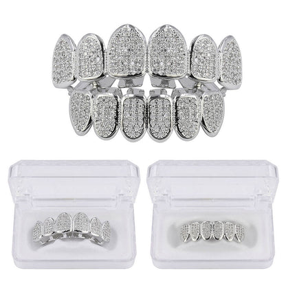 DatNewDrip silver tone full set iced out grillz with pave crystals top and bottom displayed in clear storage cases
