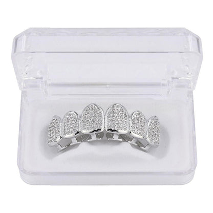 DatNewDrip silver six tooth iced out grillz with pave stones in clear display case