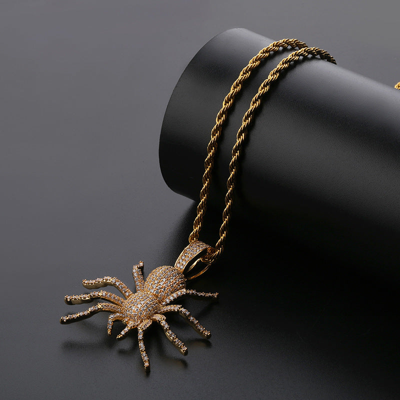 DatNewDrip iced out black spider pendant on gold rope chain with pave crystals for bold style