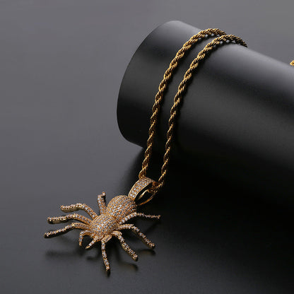 DatNewDrip iced out black spider pendant on gold rope chain with pave crystals for bold style