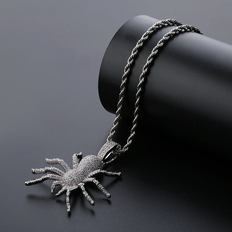DatNewDrip iced out black spider pendant on twisted black rope chain encrusted with clear stones