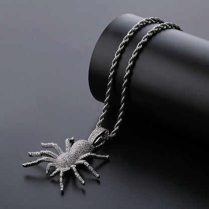 DatNewDrip iced out black spider pendant on twisted black rope chain encrusted with clear stones